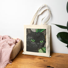 Load image into Gallery viewer, Green-Eyed Black Cat Tote Bag | Cat Portrait, Botanical Background
